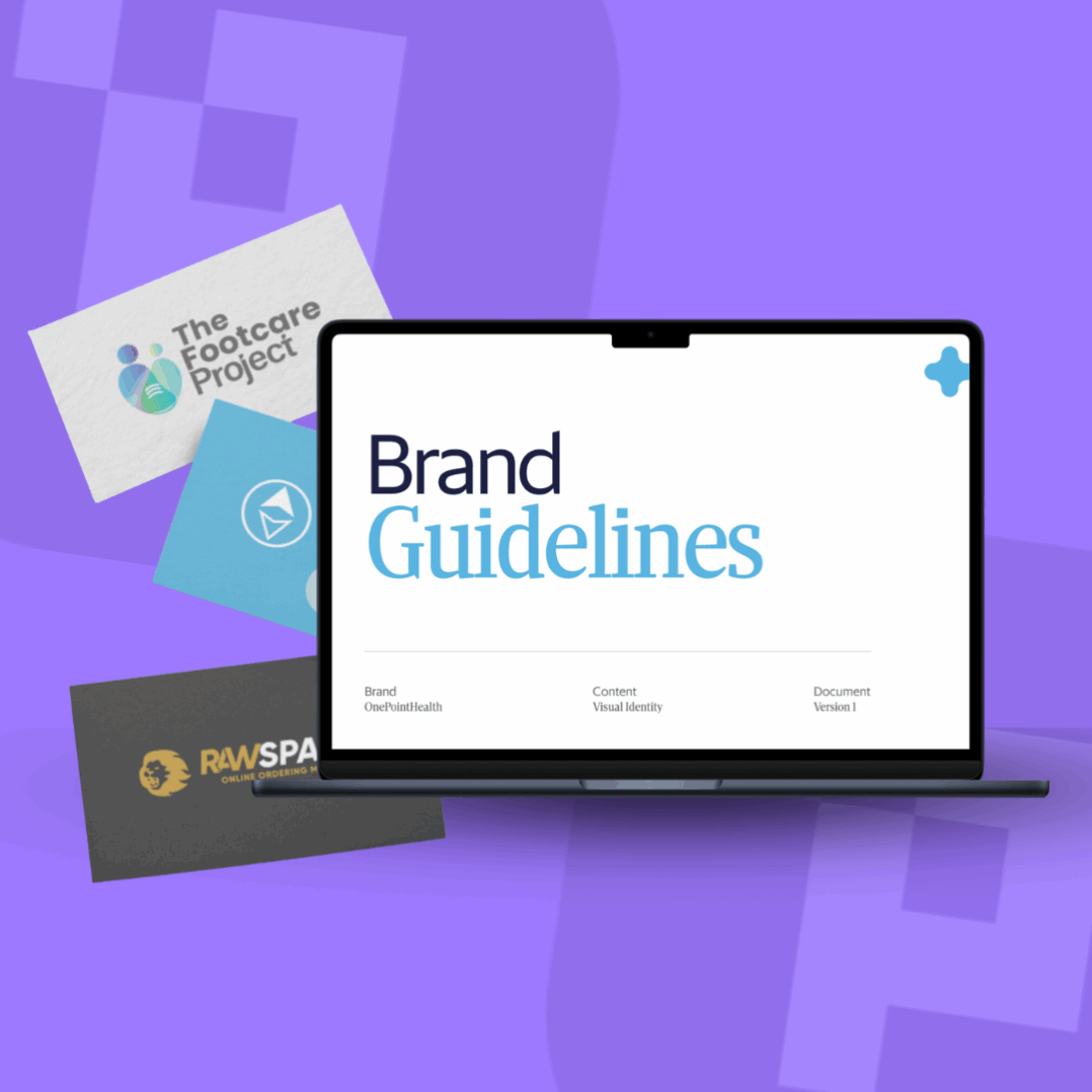 a laptop with brand guidelines and business cards